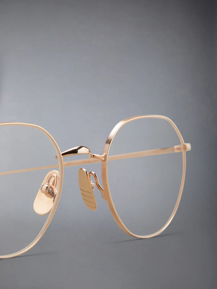 ROUND EYEGLASSES IN TITANIUM 52 ROSE GOLD CLEAR