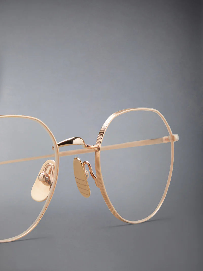 ROUND EYEGLASSES IN TITANIUM 48 ROSE GOLD CLEAR